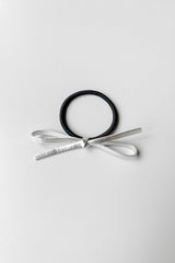 HAIR TIE WITH METALLIC BOW