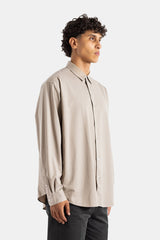 Kanemasa Phil. chemise homme beige vue de profil coupe oversize manches longues poignets boutonnés jersey coton