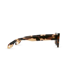 Side view of Cookie Sunglasses by Elisa Johnson: brown and beige tortoiseshell acetate frames with thick arms, round lenses, two small holes near the arm tips, a gold M detail, and UV400 protection. Brand: Elisa Johnson.