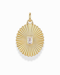 The Cora Fluted Charm by Mod + Jo showcases a radiant sunburst design, featuring an emerald-cut crystal at its center. Crafted in 14k gold, the pendant's ribbed detailing and top loop make it an elegant addition to any necklace.