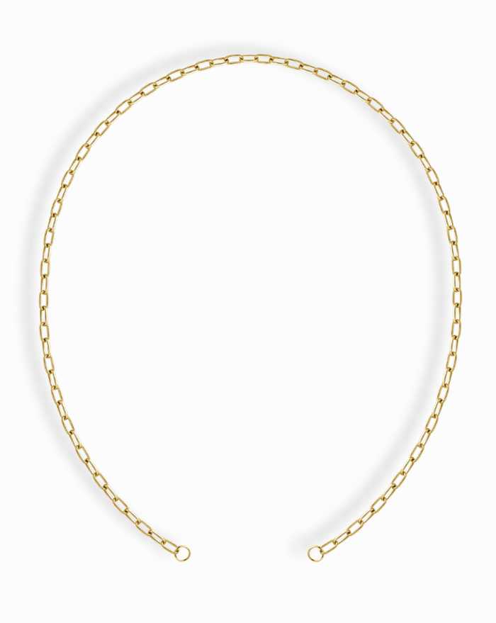 The Darcy Paperclip Enhancer Chain by Mod + Jo features elongated, rectangular links with 14k gold plating, finished with two small loops, and is styled in an open circle on a white background.