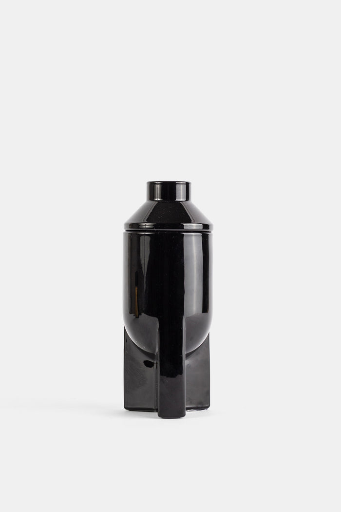 Bougie L'apparition 200g flacon noir laqué brillant design sculptural minimaliste sur socle géométrique SS26