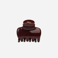 The BRAID & BOW Medium Burgundy Swirl Hair Claw is a stylish, dark maroon hair accessory with a glossy finish and five rounded teeth for a secure hold, beautifully presented against a plain white background.