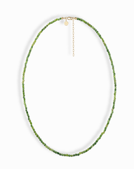 The Mod + Jo Merit Gemstone Necklace features small, faceted green beads in a single strand with a 14k gold-filled clasp and extender chain, shown on a white background.