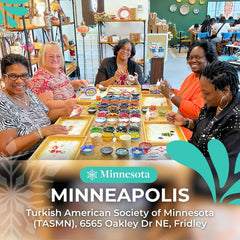 Five women creating mosaic art at a table filled with colorful mosaic tiles and bowls inside the Turkish American Society of Minnesota in Minneapolis