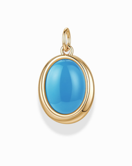 The Rory Gemstone Charm by Mod + Jo features a smooth, oval-shaped bright blue turquoise gemstone set in a gold bezel with a loop at the top for attaching to a chain. This elegant piece of jewelry is displayed against a white background.