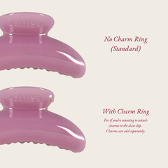 Close-up of two pink SuperClip Hair Claws by Karst Essentials in Buttermilk: top is "No Charm Ring (Standard)", bottom is "With Charm Ring" with a gold ring to add charms. Durable, stylish, and ideal for personalizing your look. Charms sold separately.
