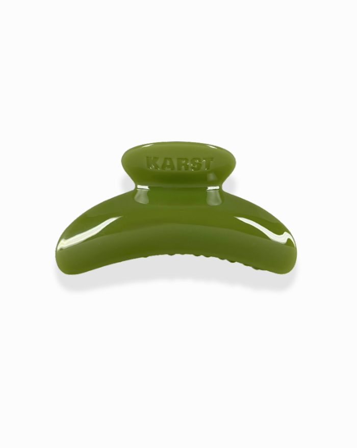 The SuperClip Hair Claw, in olive green and made from durable cellulose acetate with "KARST" embossed on top, is shown against a white background.