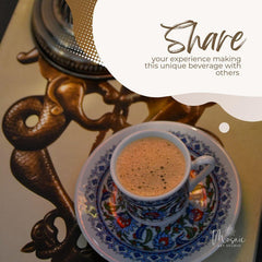 Foamy Turkish coffee in a colorful traditional cup and saucer on ornate bronze table