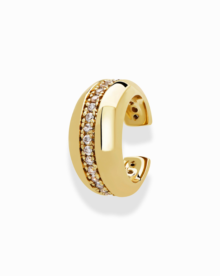 The Mod + Jo Brianne Pave Ear Cuff features tarnish-resistant gold, a central channel of sparkling white stones, smooth polished edges, and an open back design.