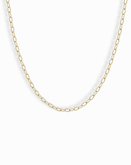 The Mod + Jo Darcy Mini Paperclip Chain Necklace features small, rectangular gold plated links and is displayed against a plain white background.
