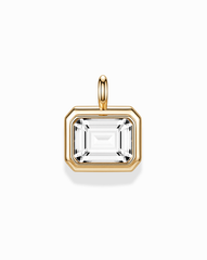The Elsie Sapphire Bezel Charm by Mod + Jo features a rectangular, emerald cut lab-grown white sapphire set in a 14k gold bezel with a gold bail, showcased on a white background.