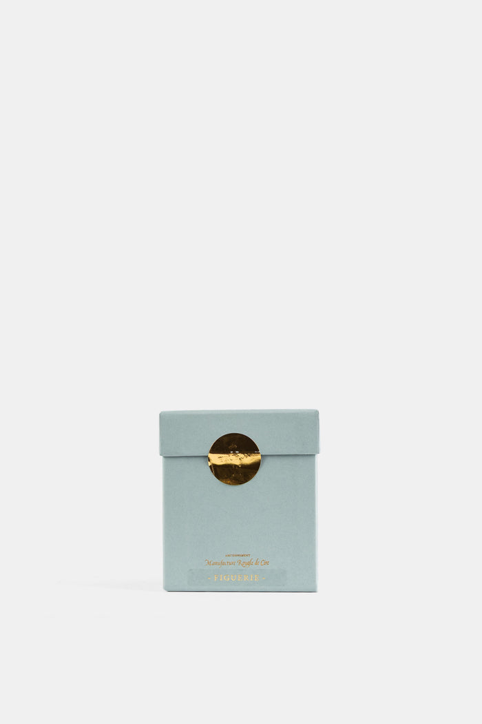 Trudon La Figuerie packaging luxe bleu céladon fermé par sceau métallique doré, présentation minimaliste
