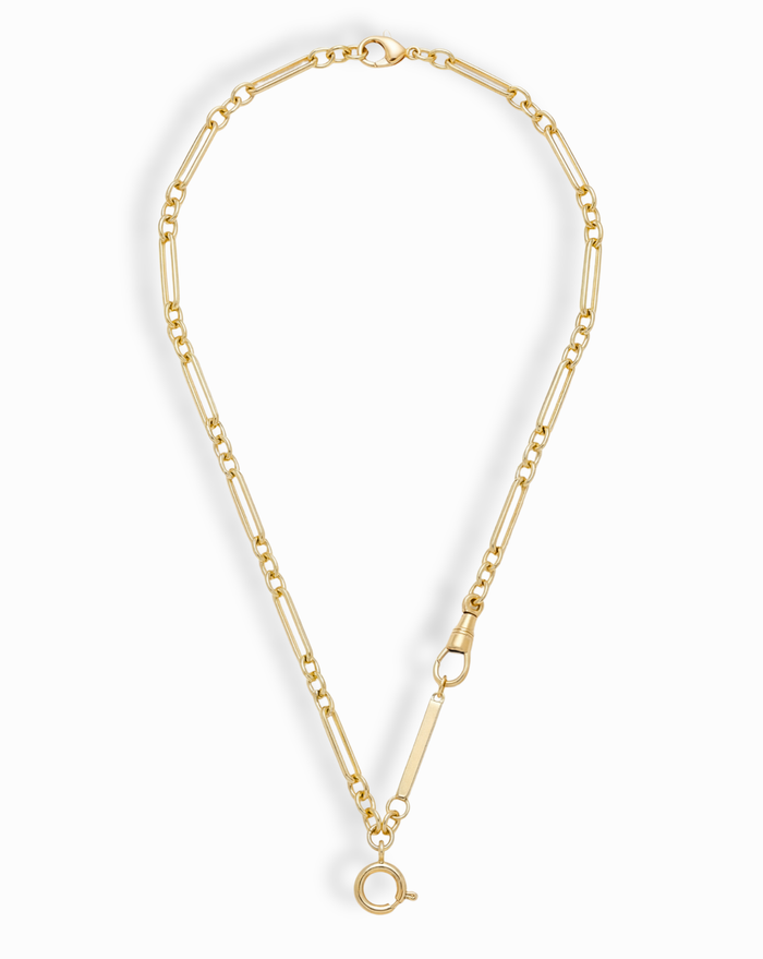 The Liam Space Bar Chain Necklace by Mod + Jo features a 14k gold-plated elongated oval link design with a large round clasp at the bottom and a smaller side clasp, arranged in an open circle on a white background.