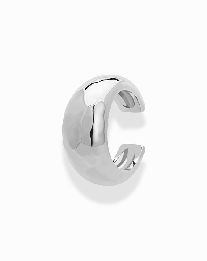 The Mod + Jo Logan Hammered Ear Cuff is a tarnish-free, semi-circular silver cuff with a wide, open-ended hammered finish—no piercing needed—shown on a plain white background.