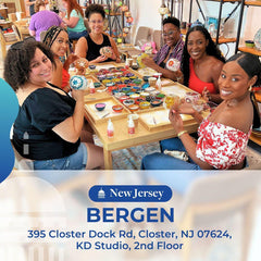 Group of women enjoying mosaic art workshop at KD Studio in Bergen, New Jersey, creating colorful decorative globes
