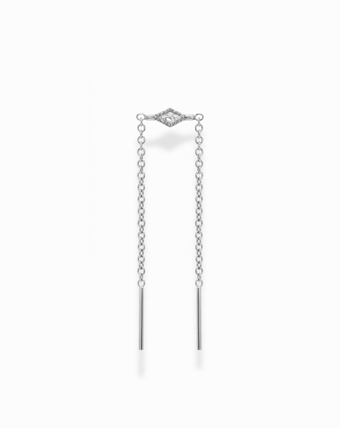 The Nicole Kite Threader Earring by Mod + Jo features a central marquise-shaped setting embellished with sparkling cubic zirconia stones, all crafted in a sleek rhodium-plated finish. Two delicate chains extend from the centerpiece, each ending in a thin bar. The earring is presented against a plain white background.