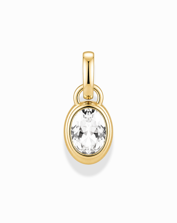 The Olly Sapphire Bezel Charm by Mod + Jo features a round, clear lab-grown white sapphire bezel-set in 14k gold, shining against a white background.