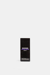 Comme des Garçons Parfums Jaisalmer Series 3 emballage noir mat typographie violette et blanche fond blanc