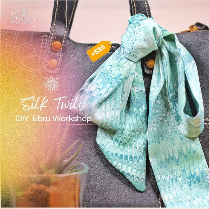Light blue silk twilly scarf with wave pattern tied to black leather bag handle, DIY Ebru workshop promo