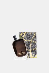 Comme des Garçons Parfums Wonderoud coffret écorce dorée avec flacon parfum posé devant son étui luxe